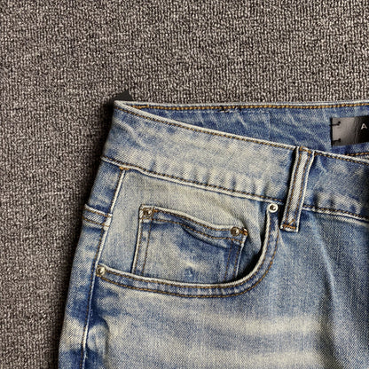 AMIRI VARSITY LOGO JEANS